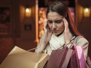 Stressed woman doing Christmas shopping