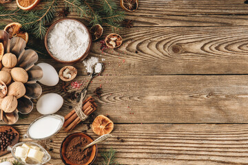  Ingredients for making christmas cupcake on wooden background, top view, free space for text