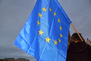 Flag of European Union hold by protester during pro-EU demonstration in Krakow after Polish government decided veto for european budget
