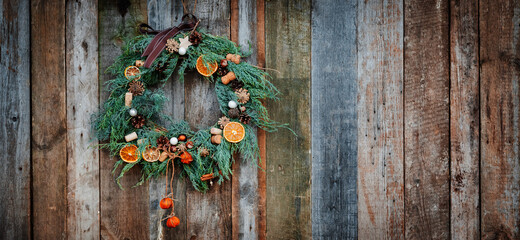 Green Christmas Wreath on Wooden Background