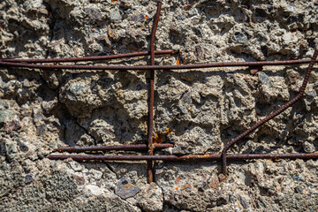 The texture of a stone wall, flooring, concrete destruction, metal corrosion and rusty antiquity, the basis of construction reinforcement and ceilings, paint chips