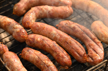 Beautiful fried sausages in a natural shell on the grill