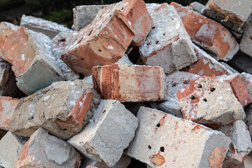 Red brick stack. Old, used building material. Waste recycling and reusable