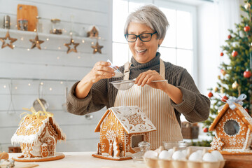 Woman cooking gingerbread house