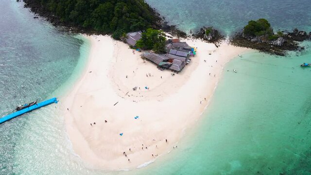 Aerial view of drone, Scene of Beautiful nature Top view of White beach sand in summer day, Seawater clear and blue green. Nature in Khai Now and Khai Maew Iland. At Khai Maw island, Phuket, Thailand.