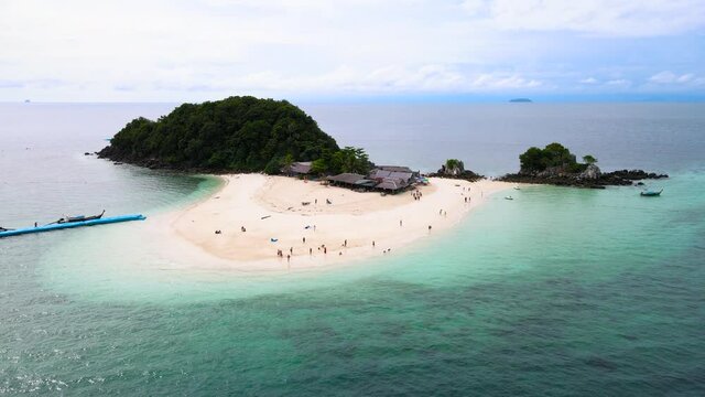 Aerial view of drone, Scene of Beautiful nature Top view of White beach sand in summer day, Seawater clear and blue green. Nature in Khai Now and Khai Maew Iland. At Khai Maw island, Phuket, Thailand.
