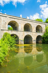 Beautiful old bridge with arches in Tounj on Tounjcica river, Croatia