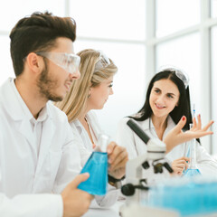 rear view.a group of scientists working in a modern laboratory