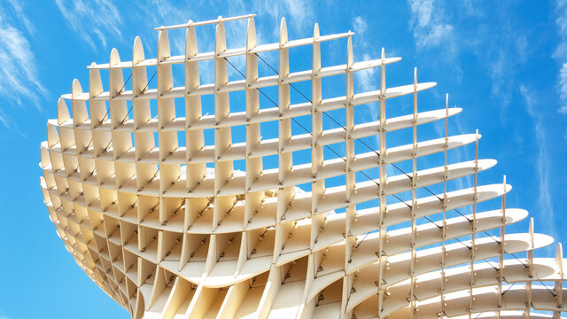 Seville, Spain - June 24, 2019: Detail of the futuristic wooden structure situated in the old square Plaza de la Encarnacion, known as Las Setas de la Encarnacion or the Mushrooms of the Incarnation