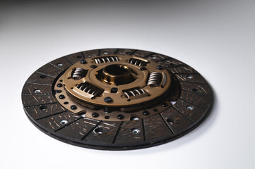 New auto clutch disc. Spare parts for car maintenance and service