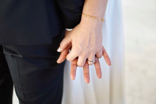Close-up Of Couple Holding Hands