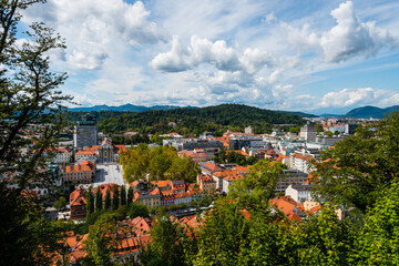 Scenic view from the Ljubljana Castle over the Tivoli park on sunny day in late summer with clouds