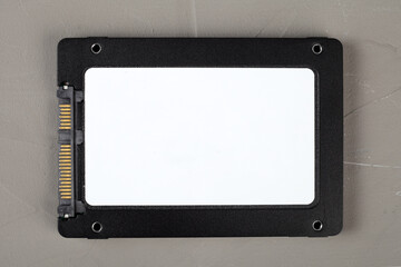 ssd hard drive on a concrete background, close-up, top view.