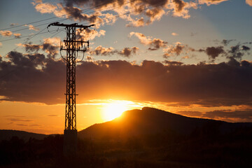 Sunset on the mountain with light tower