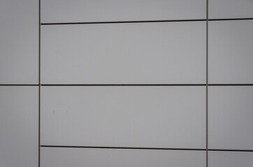 Modern white facade of a building as a texture or background