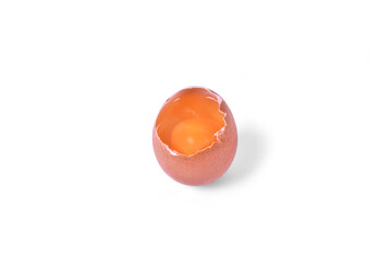 Broken chicken egg on white background