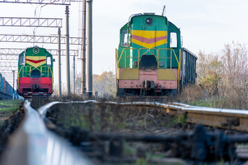 Two green locomotives on flights.
