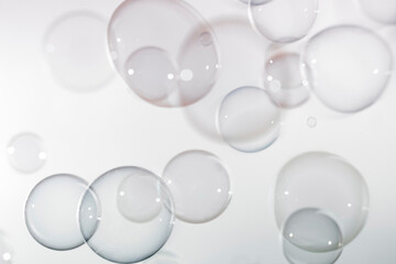 Abstract,  Transparent soap bubbles floating in the air. Natural freshness summer holiday background.