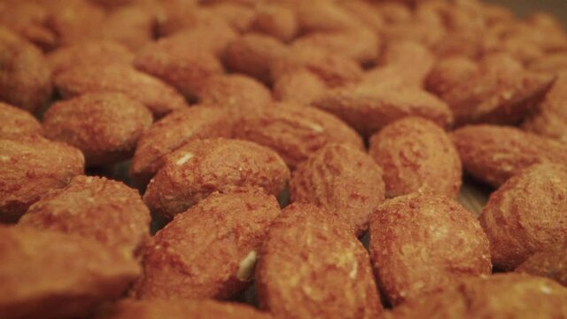 Nuts in sauce close-up. delicious fried kibbe on wooden table, top view.