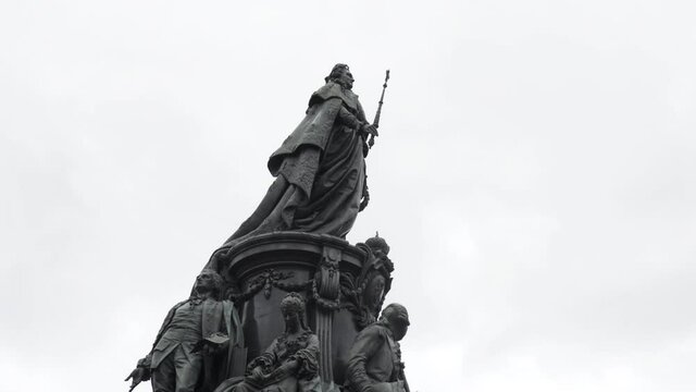 Monument to Catherine II on cloudy sky background, Saint Petersburg, Russia. Action. Bottom view of a stunning monument in honor of Empress Catherine II.