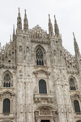 Fototapeta na wymiar Exterior of Milan Cathedral in Sunny Day: Religious Theme