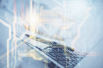 Double exposure of desktop with computer and world map hologram. International data network concept.