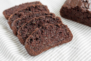 Homemade Chocolate Zucchini Bread on cloth, side view. Close-up.