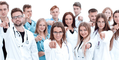 group of diverse medical professionals pointing at you