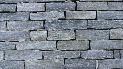 Grey rubble stone wall  - texture
