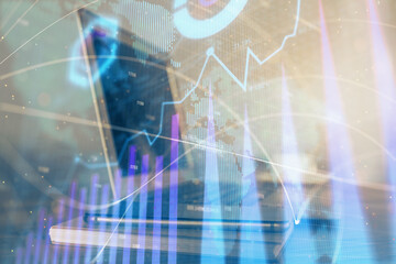 Forex market chart hologram and personal computer background. Multi exposure. Concept of investment.
