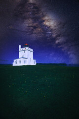 Iceland lighthouse with milky way