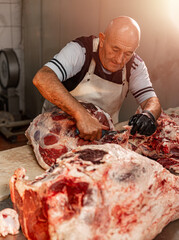 Butcher working in factory