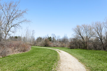 Hiking trail through Beatty Point Park in the early spring. Braddock Bay Wildlife Management area in the town of Greece, New York.