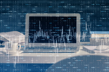 Financial graph colorful drawing and table with computer on background. Multi exposure. Concept of international markets.