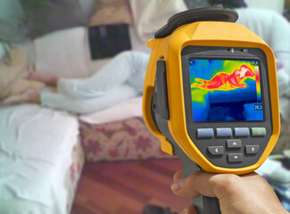 Recording with thermal camera Young woman is lying on the bed - 394622391