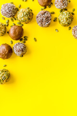 Top view of raw vegan energy balls with nuts and cacao