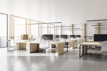 Modern coworking office interior with equipment and computers