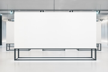 Modern white gallery interior with blank exhibition stand
