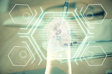 Blue fingerprint hologram over woman's hands taking notes background. Concept of protection. Double exposure