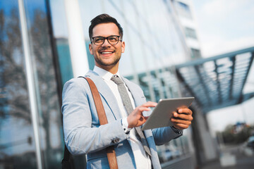 Happy executive using tablet