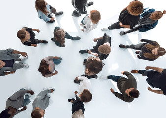 top view .groups of diverse young people moving towards each other