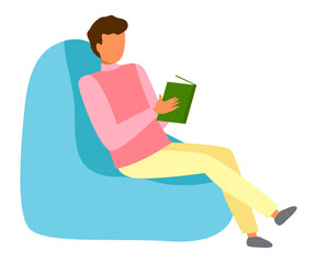 Young man is sitting in cozy blue armchair and reading. Reading, having a good time, self-education. Stay home while quarantined. Guy sitting in blue pouf. Flat vector image of a man in an armchair.