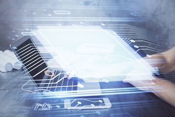 Businessman with computer background with technology theme hologram. Concept of hightech. Multi exposure.