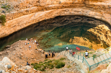The top View of Bimmah Sinkhole, natural crater limestone blue lagoon from meteorite in Hawiyat...