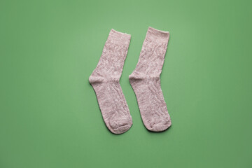 Warm socks on color background