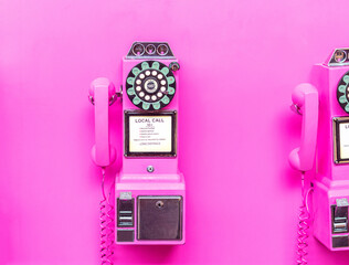 pink coin payphone on pink wall - obrazy, fototapety, plakaty