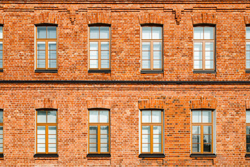 Fototapeta premium Beautiful vintage red brick building at sunny day