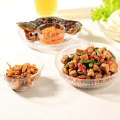 Sautee Tempeh, Chilli Paste, Fried Catfish, and Shredded Tuna Served withh Tea, Cheap and Popular Menu of Indonesian Cheap Restaurant (Warung Tegal/Warteg). Usually Served with Rice. Selected Focus