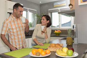 Happy couple having a wonderful breakfast time at home