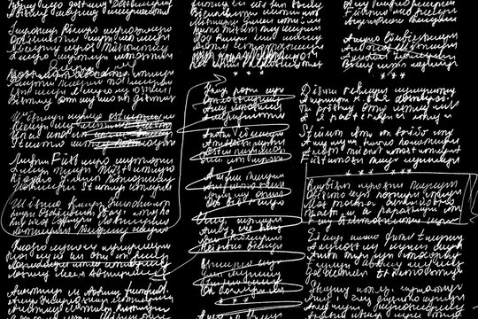 Texture of unreadable text with corrections on a black background. Poems, illegibly written, on a black background with corrections.